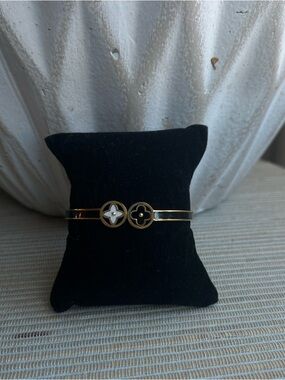 Gold-Tone Double Medallion Bangle Bracelet with Black and White floral Accents